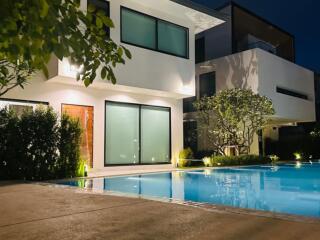 Modern house with pool at night