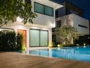 Modern house with pool at night