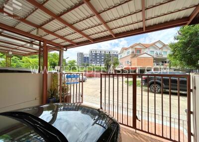 Covered carport with view of residential area