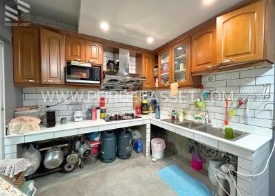 Modern kitchen with numerous appliances and storage