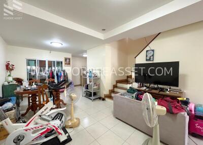 Spacious living area with furniture and fitness equipment