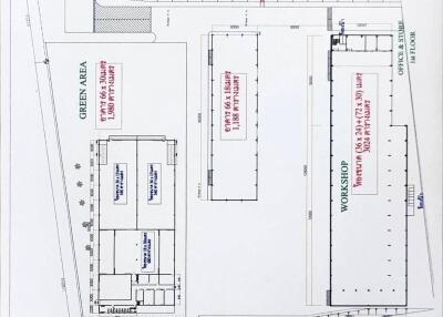 Property layout showing various areas such as workshops, parking, and green areas