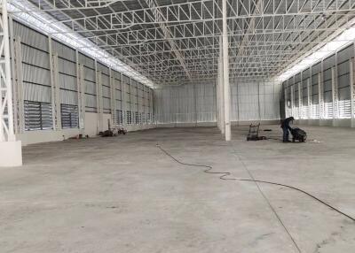 Spacious empty warehouse with high ceiling