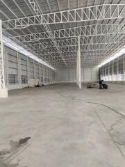 Spacious empty warehouse with high ceiling