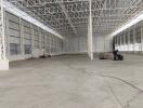 Spacious empty warehouse with high ceiling