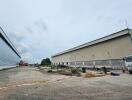 Outside view of warehouse buildings and parking area