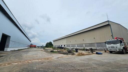 Outside view of warehouse buildings and parking area