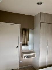 Modern bedroom with mirror and wardrobe