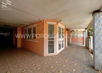 Covered outdoor area with tiled flooring