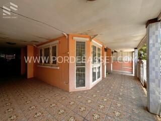 Covered outdoor area with tiled flooring