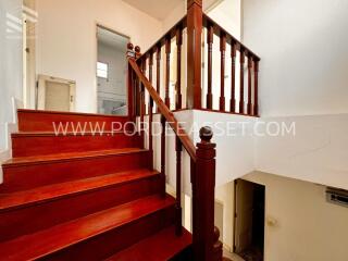 staircase with wooden steps and railing