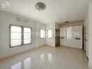 Spacious bedroom with built-in wardrobes and large windows