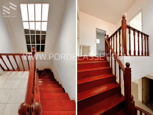 Staircase with red wooden railing