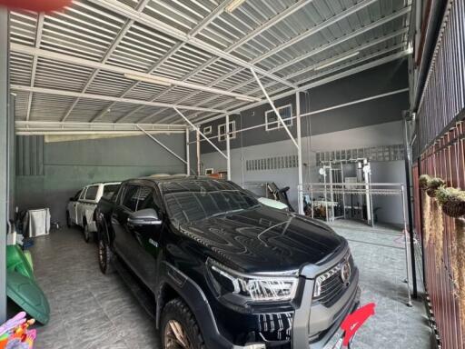 Spacious garage with two vehicles