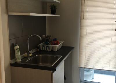 Small kitchen with sink and shelves