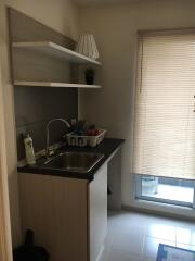 Small kitchen with sink and shelves