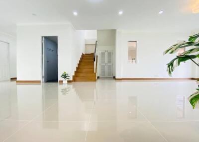 Spacious and modern living area with staircase