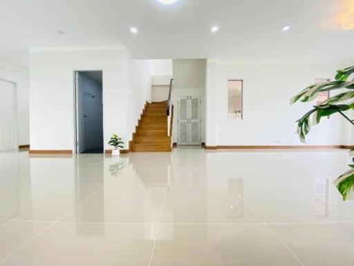 Spacious and modern living area with staircase