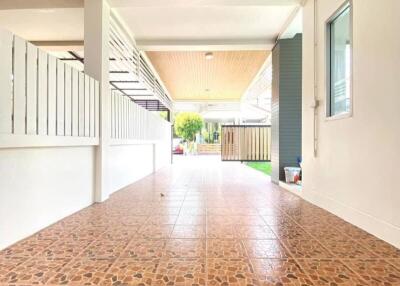 Covered outdoor patio with tiled flooring