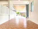 Covered outdoor patio with tiled flooring