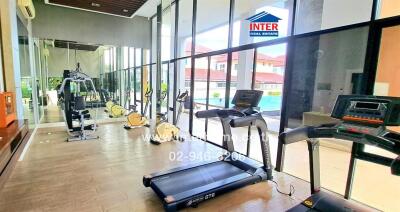 Modern gym with cardio and strength training equipment