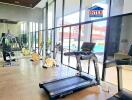 Modern gym with cardio and strength training equipment