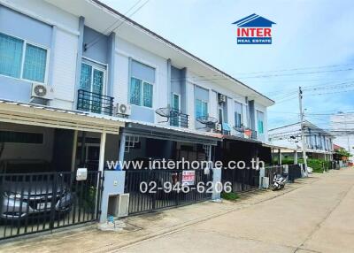 Exterior of a townhouse building on a street