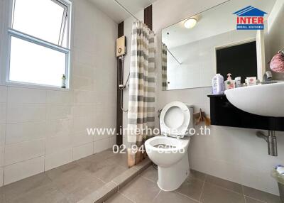 Clean and modern bathroom with shower and toilet