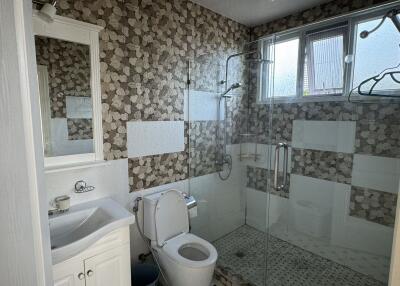 Modern bathroom with shower and tiles