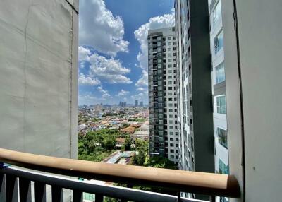 View of the city from an upper floor balcony