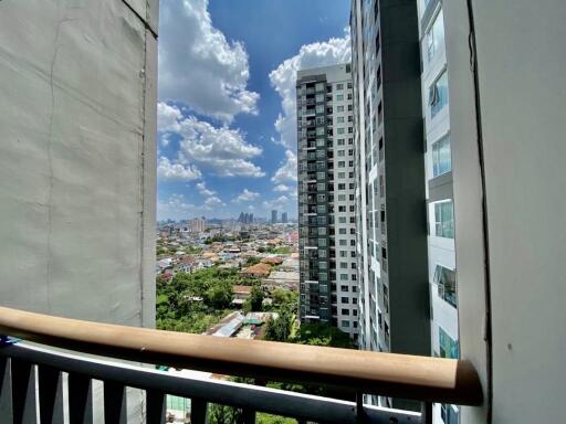 View of the city from an upper floor balcony