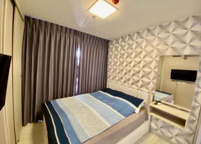 Modern bedroom with geometric wall design