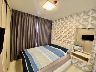 Modern bedroom with geometric wall design