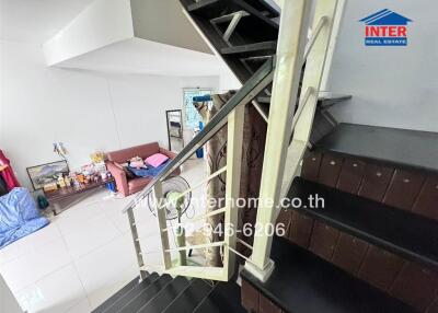 Staircase in living area with furniture