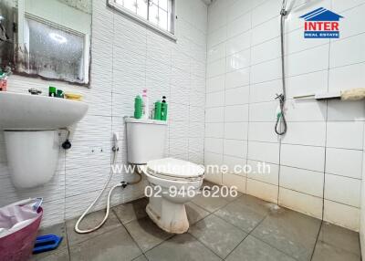 Bathroom with shower, toilet, and sink