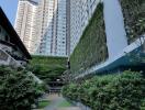 Exterior view of a high-rise residential building with greenery