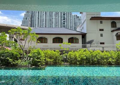 Modern pool area with city skyline view