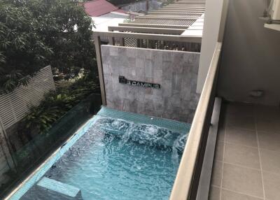 Private swimming pool with a water feature