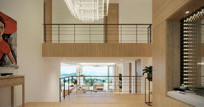 Modern living area with a large chandelier and natural lighting