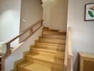 Wooden staircase with railings in a modern home