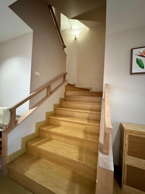 Wooden staircase with railings in a modern home