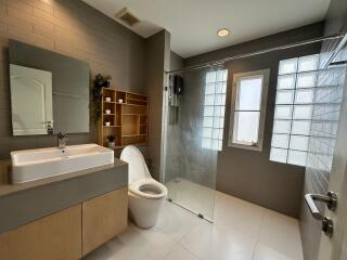 Modern bathroom with shower and large tiles