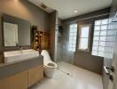 Modern bathroom with shower and large tiles