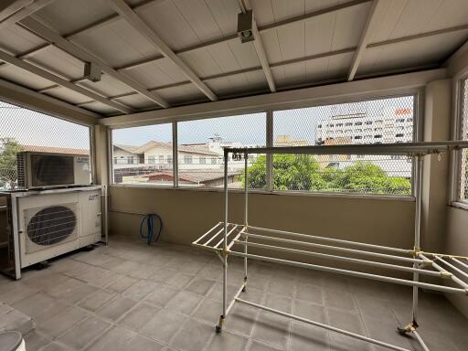 Enclosed laundry area with ample natural light