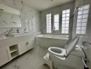 modern bathroom with bathtub and large windows