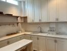 Modern white kitchen with island and wooden floor