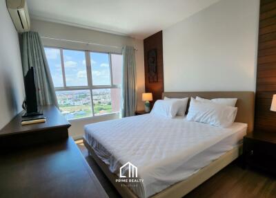 Bedroom with a large window and a view