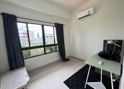 Bright bedroom with large window and air conditioning