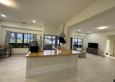 Spacious open concept kitchen and living area with natural light