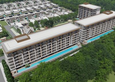 Aerial view of a modern apartment complex surrounded by greenery